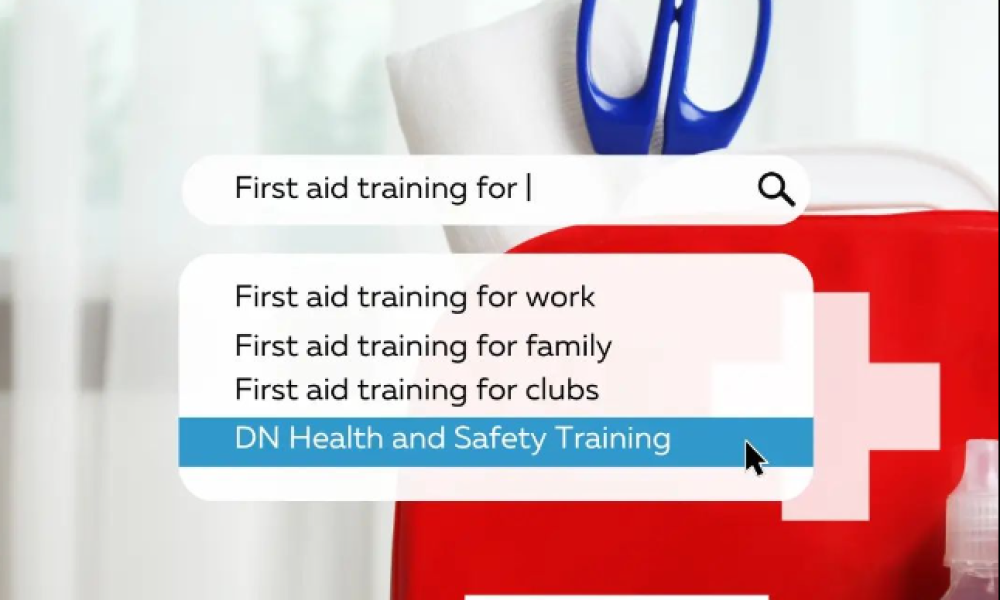 DN Health and Safety Training website displayed in a search bar, with a first aid kit in the background.