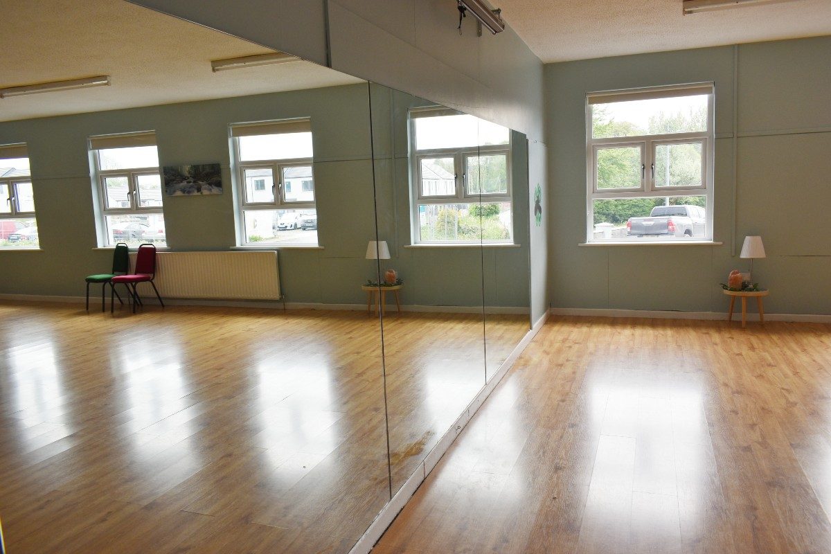 Physical activity room with wooden floor.