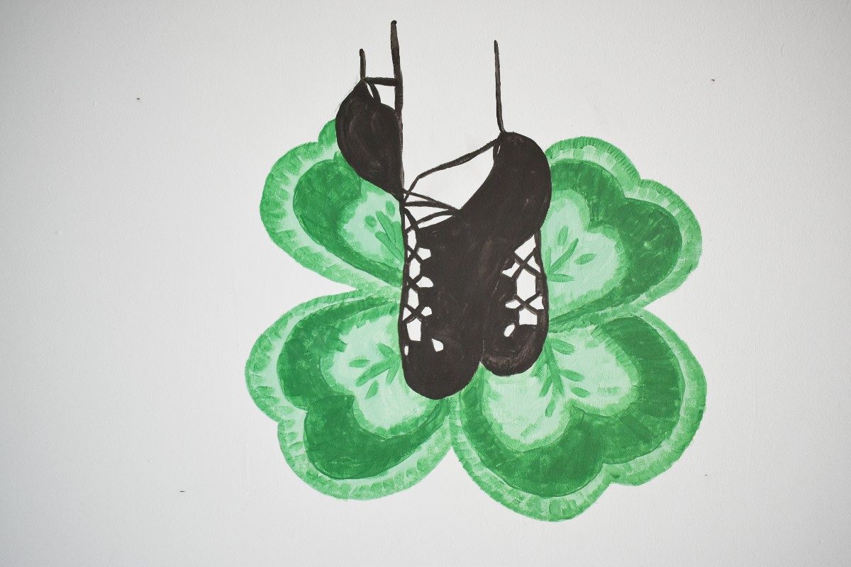 Black shoes on a shamrock.