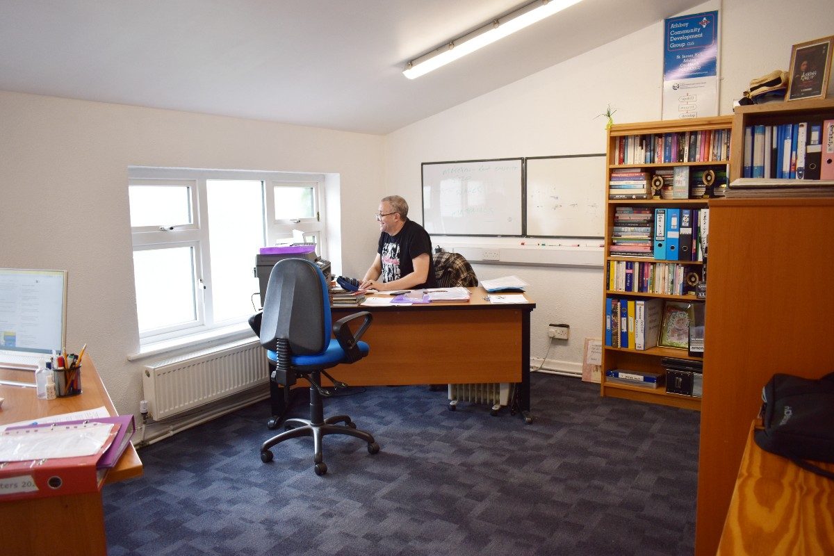 A person works at the desk in the office at the St. James' Hall Pavillion