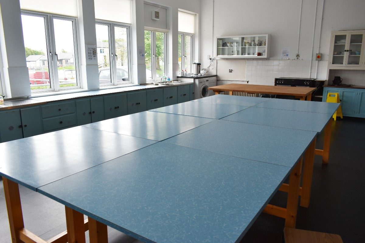 A blue table in the kitchen.