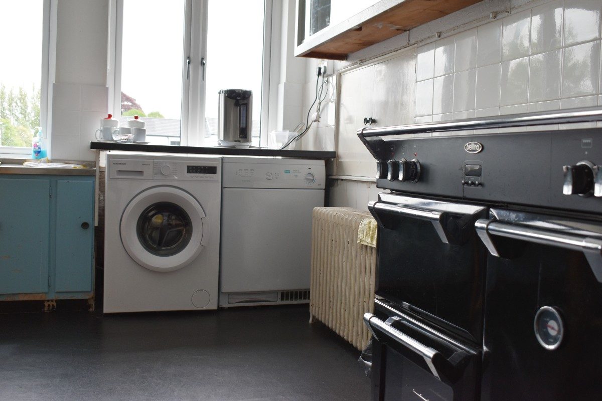 Kitchen with washer and dryer appliances.